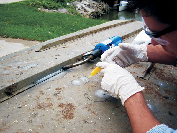 epoxy being used on a metal boat