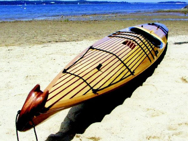 wooden kayak on a beach