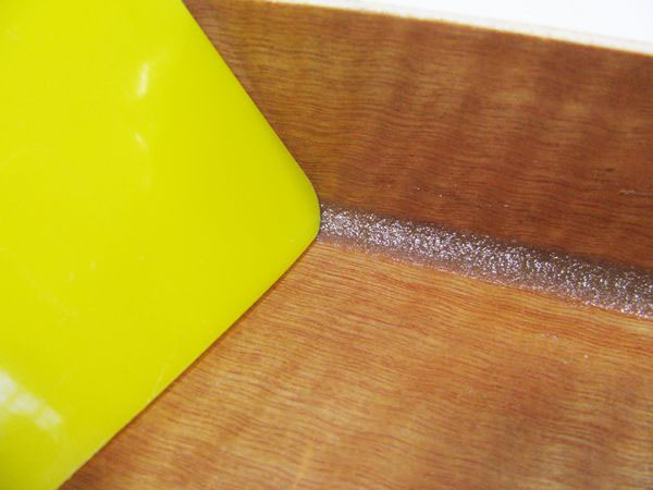 Corner of a counter being re-caulked 